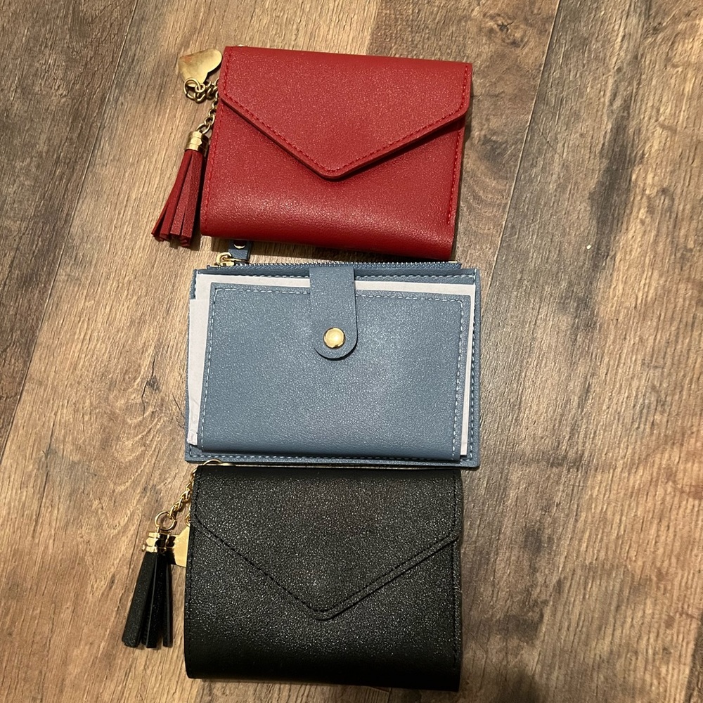 NEW wallets sold individually of choice of color